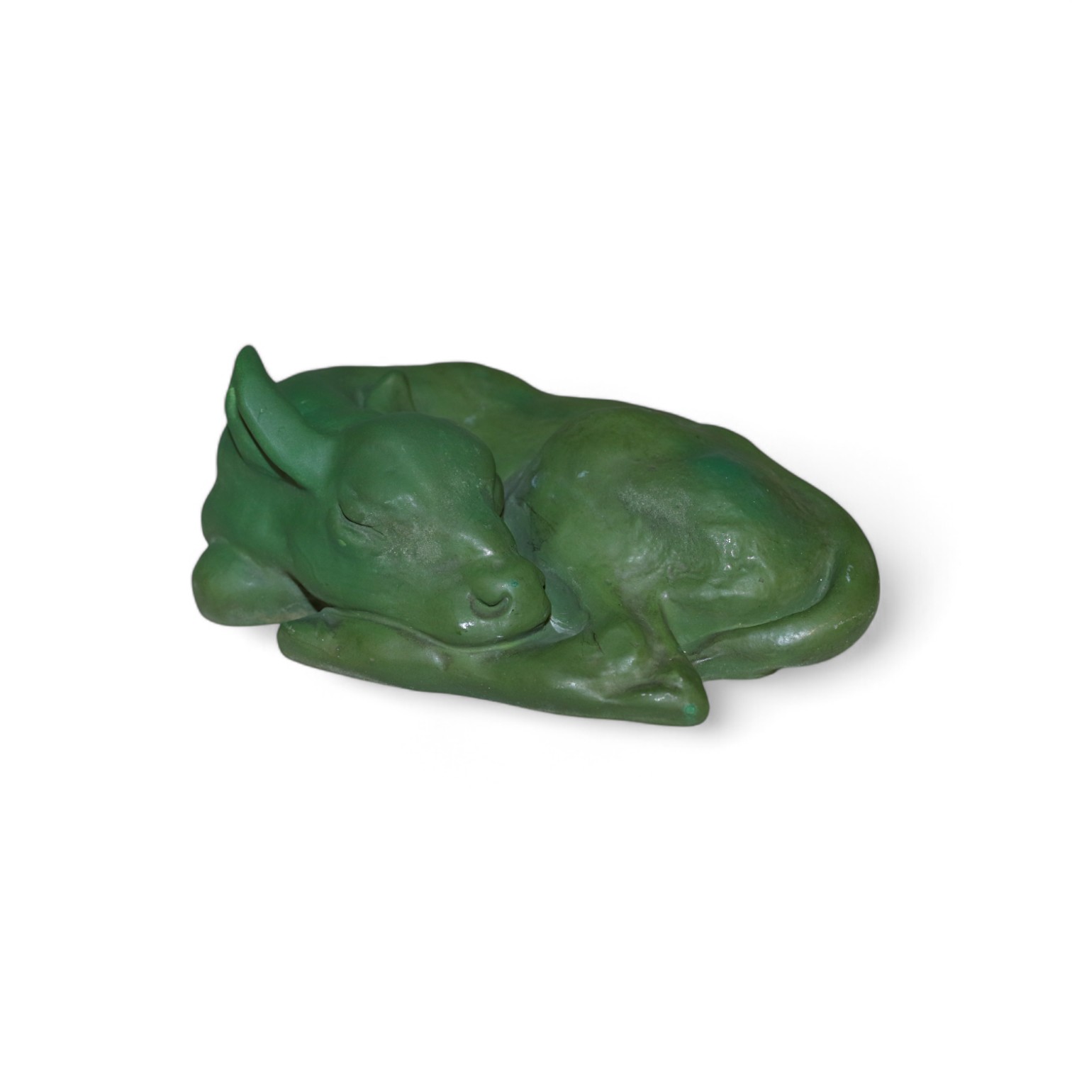 A rare Royal Doulton ‘Sleeping Calf' figure designed by Raoh Schorr, impressed model no. 946, covered in a green bronze glaze printed factory mark, impressed marks, 14cm. wide. Condition - good